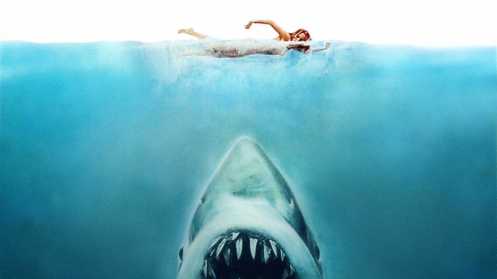 Jaws beneath a person swimming