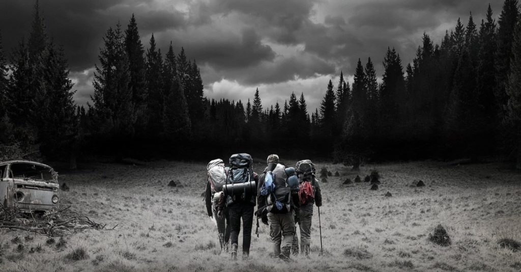 Four friends walking through the forest in The Ritual